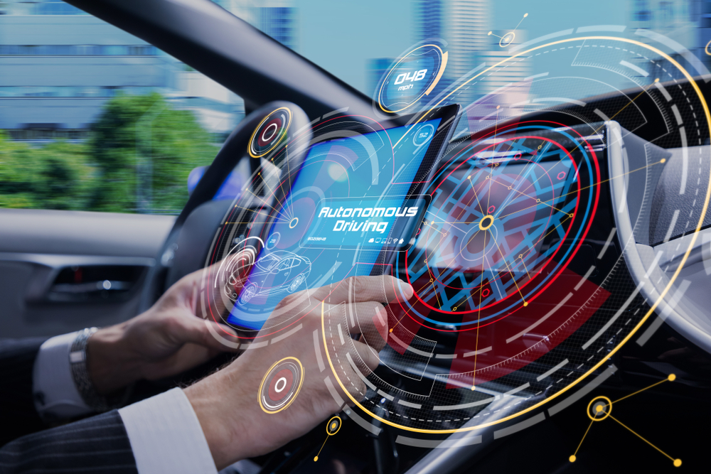 man in car with hands on dashboard